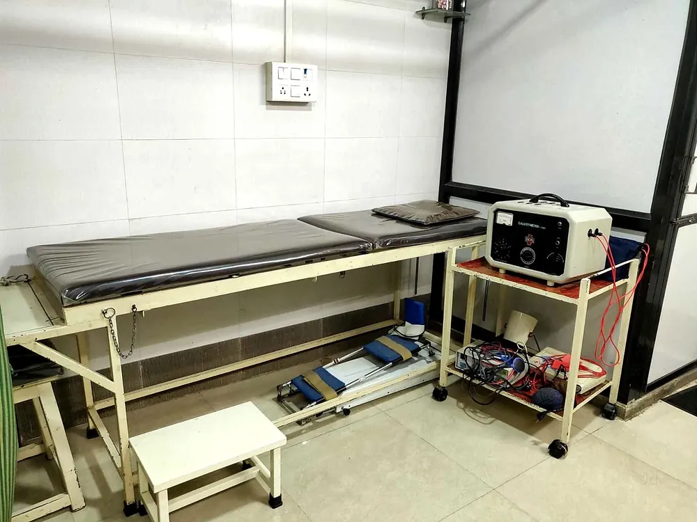 Treatment couch with an electrotherapy unit and rehabilitation equipment